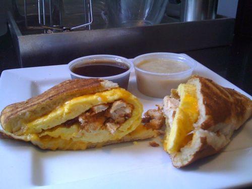 Triple Breakfast Panini Giant buttermilk pancake stuffed with fried chicken, eggs and cheddar cheese, pressed in a panini press and served with maple syrup and white gravy. (Submitted by Brett McMillin)