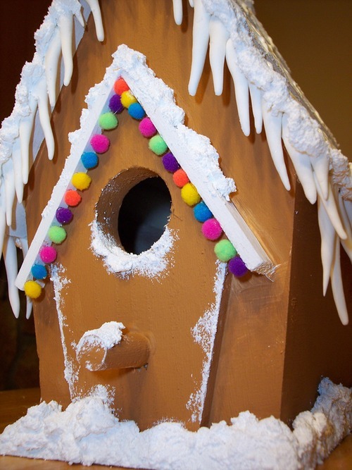 A detail close-up of the finished Gingerbirdhouse. Up close, you can tell it isn’t really food, but it still looks cute! You can still vote for both projects in the Michael’s contest, I think. We aren’t likely contenders—the first week’s winner was a snowman made by gluing three sand dollars to a popsicle stick, which is maybe not quite the level of dedication we were shooting for with our projects—but if we get a decent rating, at least we can lose with some dignity. www.michaelscontest.com/uploads/2958www.michaelscontest.com/uploads/2962